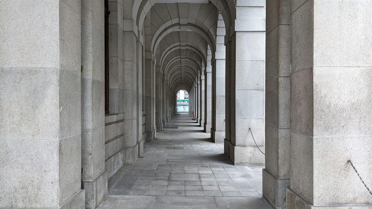 A granite arcade of repeating stone arches in Hong Kong